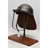 A REPRODUCTION CIVIL WAR LOBSTER TAIL HELMET, with stand (formerly from a set of balance scales) (2)
