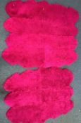 TWO PINK FAUX FUR RUGS, largest rug, 183cm x 207cm, and a modern purple rug (3)