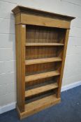A MODERN PINE OPEN BOOKCASE, with four fixed shelves, width 105cm x depth 34cm x height 187cm (