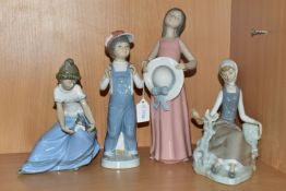 THREE LLADRO FIGURES AND A NAO FIGURE, comprising model no 4660 Shepherdess with Dove, issued 1969-