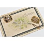 TWO EARLY 20TH CENTURY MEMORIAL BROOCHES, the first a gold brooch, rectangular form, a central glass