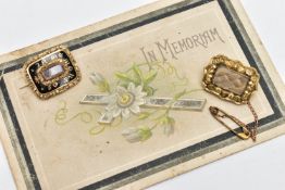 TWO EARLY 20TH CENTURY MEMORIAL BROOCHES, the first a gold brooch, rectangular form, a central glass