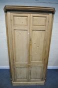 A LARGE VICTORIAN PINE PANELLED FOUR DOOR CORNER CUPBOARD, enclosing a blue painted interior, and