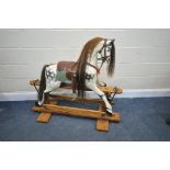 IN THE MANNER OF FH AYRES, a Victorian style dappled painted rocking horse, with brown studded
