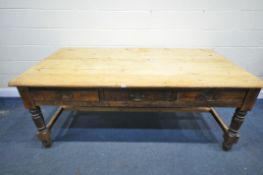 A LARGE 19TH CENTURY PINE FARMHOUSE TABLE, with three full length frieze drawers, on block and