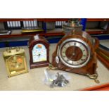 A GROUP OF CLOCKS, A BAROMETER AND AN OIL LAMP, comprising a wooden cased 'The British Anvil Clock',