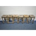 A SET OF SIX LATE 19TH EARLY 20TH CENTURY BEECH SCHOOL LABORATORY STOOLS, 34cm squared x height 56cm