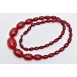 A GRADUATED BAKELITE BEAD NECKLACE, comprising of forty-three oval beads, largest measuring
