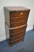 A REPRODUCTION WALNUT CHEST OF SEVEN DRAWERS, on bracket feet, width 55cm x depth 38cm x height