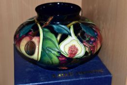 A BOXED MOORCROFT POTTERY 'QUEENS CHOICE' PATTERN SQUAT VASE, designed by Emma Bossons, painted