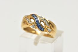 A YELLOW METAL SAPPHIRE AND DIAMOND RING, designed with a row of square cut blue sapphires,