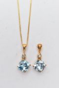 TWO 9CT YELLOW GOLD, TOPAZ AND DIAMOND PENDANTS AND A CHAIN, two of the same pendant each set with a
