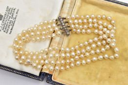 A CULTURED FRESH WATER PEARL BRACELET WITH DIAMOND SET CLASP, a four row cultured pearl bracelet,