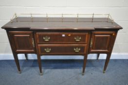 A REPRODUCTION HARDWOOD BREAKFRONT SIDEBOARD, with a brass gallery back, cupboard doors flanking two