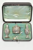 A CASED LATE VICTORIAN FOUR PIECE SILVER CRUET SET, comprising a pair of baluster pepperettes with