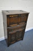 A JAYCEE REPRODUCTION OAK DRINKS CABINET, with a single drawer, width 75cm x depth 42cm x height