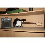 A CB SKY STRAT TYPE GUITAR with black finish and a Ion iGA03 practice amp (untested)