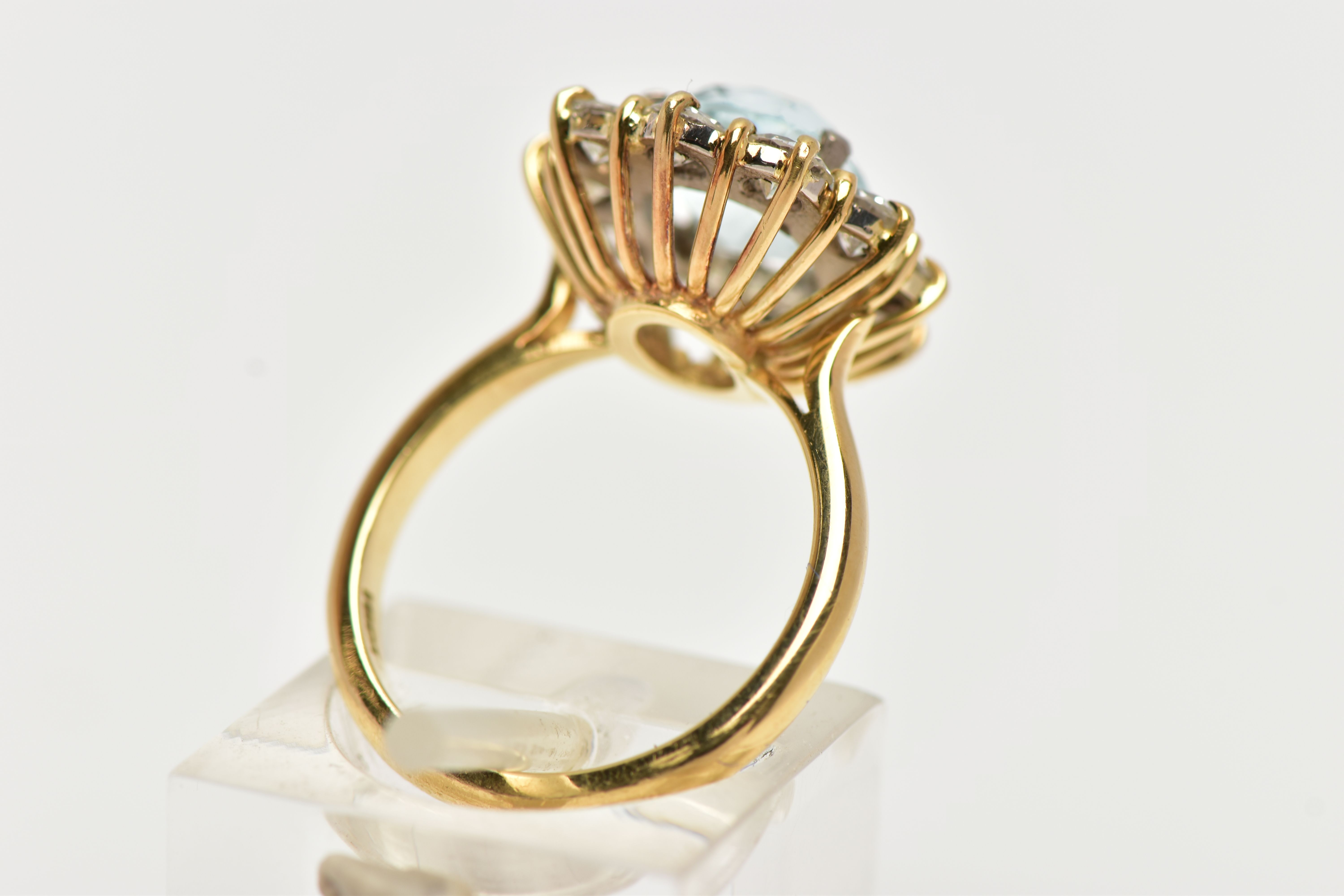 A YELLOW METAL AQUAMARINE AND DIAMOND CLUSTER RING, centring on a four claw set, cushion cut - Image 3 of 7