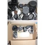 TWO TRAYS CONTAINING AFTERMARKET LENSES , six tripods and two cine cameras including Vivitar 28-
