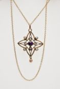 AN EDWARDIAN LAVALIER PENDANT AND CHAIN, openwork star outline, set to the centre is a circular