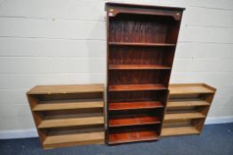 A TALL SLIM STAINED PINE OPEN BOOKCASE, with five fixed shelves, width 82cm x depth 28cm x height