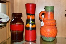 THREE WEST GERMAN VASES BY SCHEURICH, comprising a matt glazed, single handled, orange and green