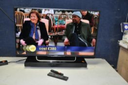 A SONY KDL42W705B 42in SMART TV with remote and a Sony HT-XT1 soundbar with remote (both PAT pass