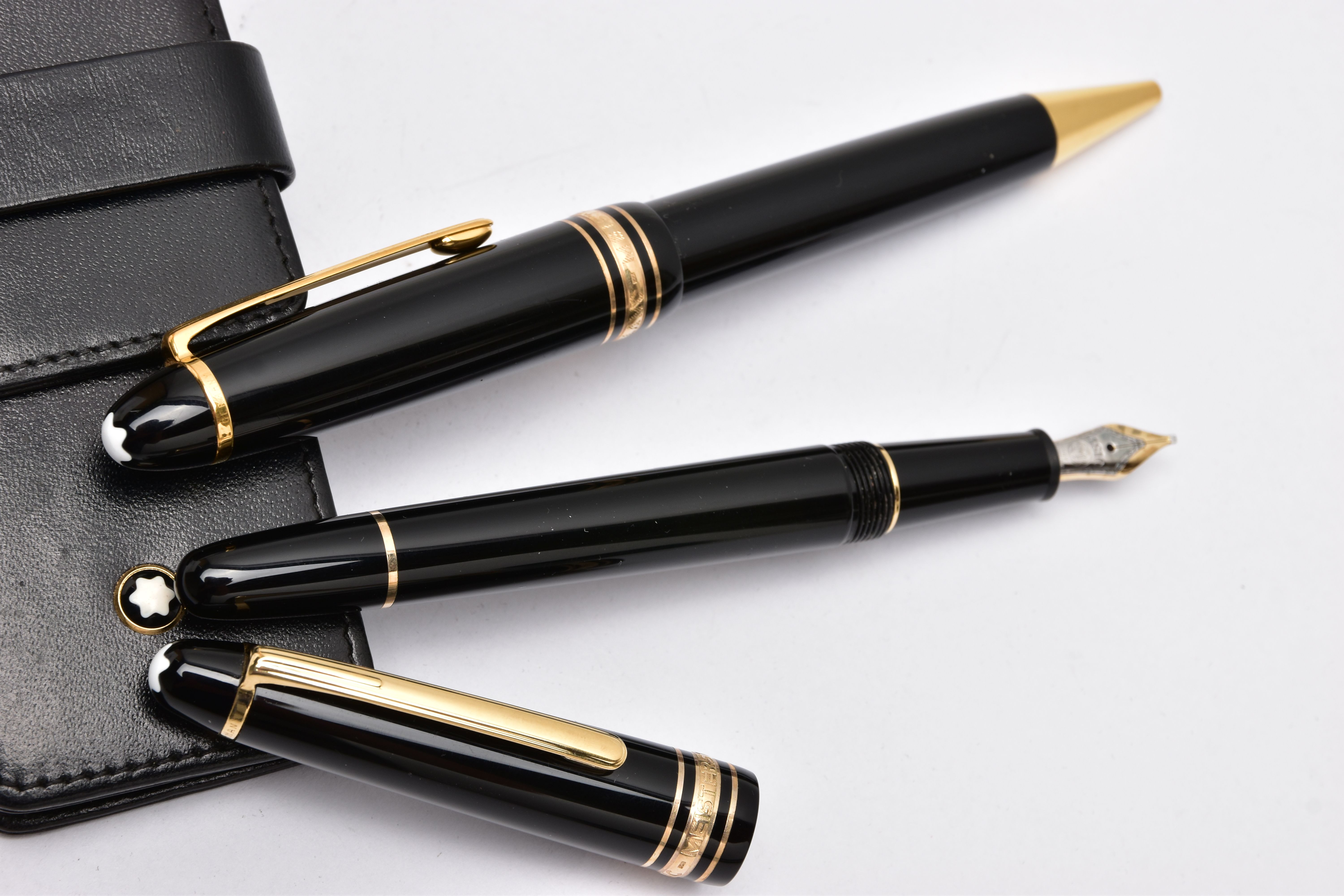 A TWO PIECE 'MONTBLANC' PEN SET, to include a black laquaer with gold detailed coller, fountain pen, - Image 3 of 4