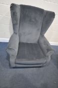 A DARK BLUE UPHOLSTERED WING BACK ARMCHAIR, with 96cm x depth 96cm x height 104cm (condition -