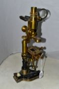 A VINTAGE TISLEY & SPILLER BRASS MICROSCOPE, appears complete, missing wooden case (1)