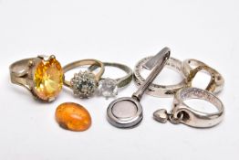 A SILVER MASONIC NAPKIN HOLDER, SIX RINGS AND A LOOSE AMBER CABOCHON, the polished napkin holder