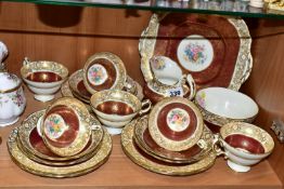 A TWENTY ONE PIECE HAMMERSLEY TEA SET, in pattern 2396, with red and gilt borders around a central