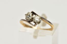 A TWO STONE DIAMOND RING, two round brilliant cut diamonds in a white metal prong setting,