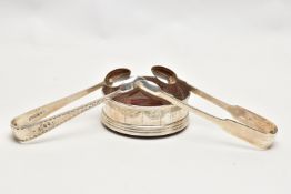 TWO PAIRS OF SILVER SUGAR TONGS AND A COASTER, the first a pair of mid Victorian, bright cut sugar