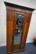 AN EDWARDIAN MAHOGANY AND MARQUETRY INLAID SINGLE MIRRORED DOOR WARDROBE, with overhanging