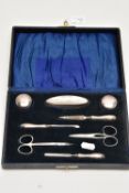 AN EARLY 20TH CENTURY CASED SILVER MANICURE SET, case opens to reveal two small glass jars with
