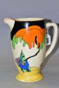 A CLARICE CLIFF WOODLAND PATTERN WATER JUG, painted with an orange and green tree among blue,
