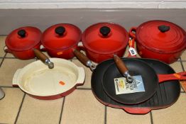 A SET OF LE CREUSET 'CERISE' LIDDED SAUCEPANS AND COOKWARE, comprising three graduated covered
