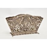 A WHITE METAL LETTER HOLDER, openwork lattice design with floral, foliage and cherub detail, stamped