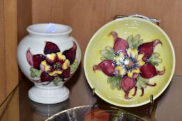 TWO MOORCROFT POTTERY 'COLUMBINE' PATTERN PIECES, comprising a pedestal dish decorated with a purple