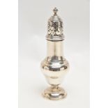 AN EARLY 20TH CENTURY SILVER SUGAR CASTER, polished form on a round base, openwork cover, hallmarked