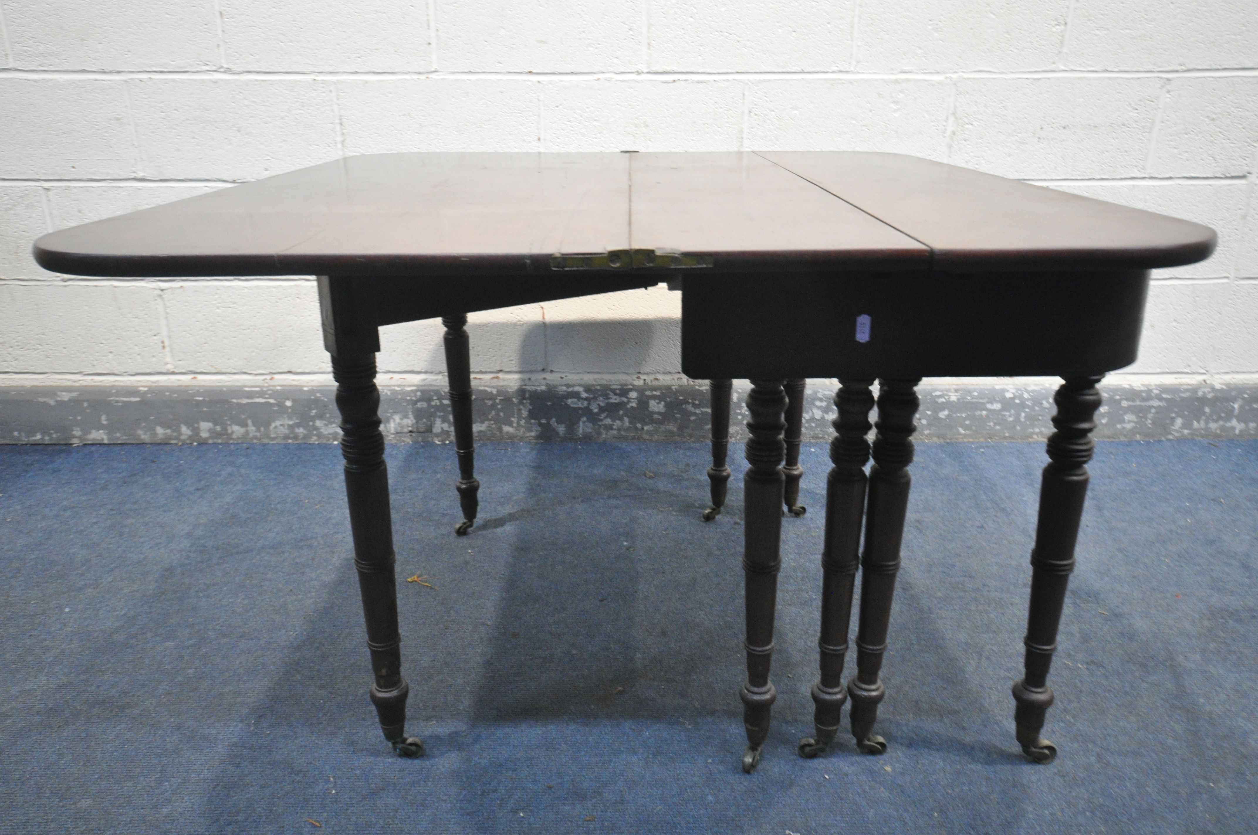 A REGENCY MAHOGANY CONCERTINA ACTION EXTENDING DINING TABLE, with two sized additional leaves, on - Image 8 of 11