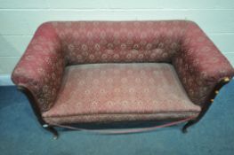 A LATE 19TH EARLY 20TH CENTURY BURGUNDY AND FLORAL UPHOLSTERED SOFA, on front cabriole legs,