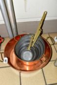 A GROUP OF COPPER SAUCEPANS, to include two large copper pans, diameter 24cm and 34cm, together with