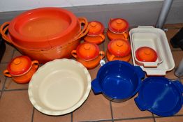 A GROUP OF LE CREUSET AND OTHER COOKWARE, to include five Le Creuset orange stoneware covered soup/