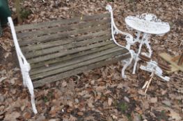 A SLATED GARDEN BENCH with cast aluminium ends along with a cast aluminium demilune garden table