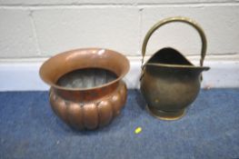 A BEATEN COPPER PLANT POT, and a brass coal scuttle (2)