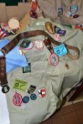 A QUANTITY OF ASSORTED SCOUT AND GUIDE RELATED ITEMS, to include shirts, assorted badges, pennants