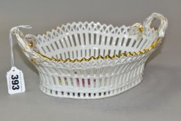A 20TH CENTURY KPM BERLIN RETICULATED TWIN HANDLED BASKET OF SHAPED OVAL FORM, painted with