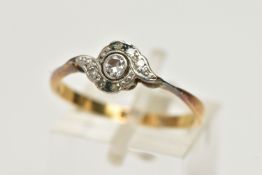 A YELLOW METAL DIAMOND RING, designed with a central round brilliant cut diamond, collet set in a